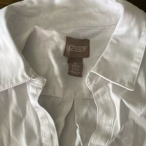 White long sleeve tunic with side button detailing. Great condition. Chicos 2
